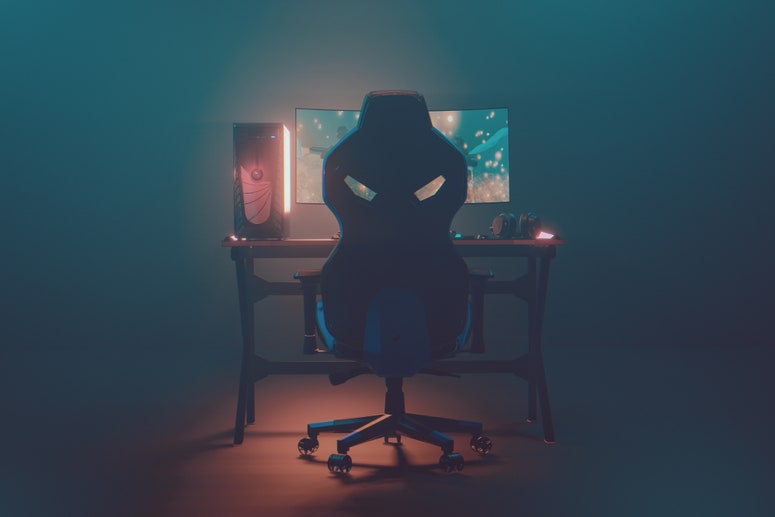empty gaming desk with monitor and gaming chair